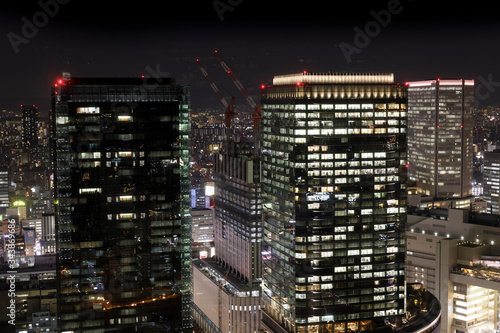 Modern high rise buildings at night in Osaka, Japan.