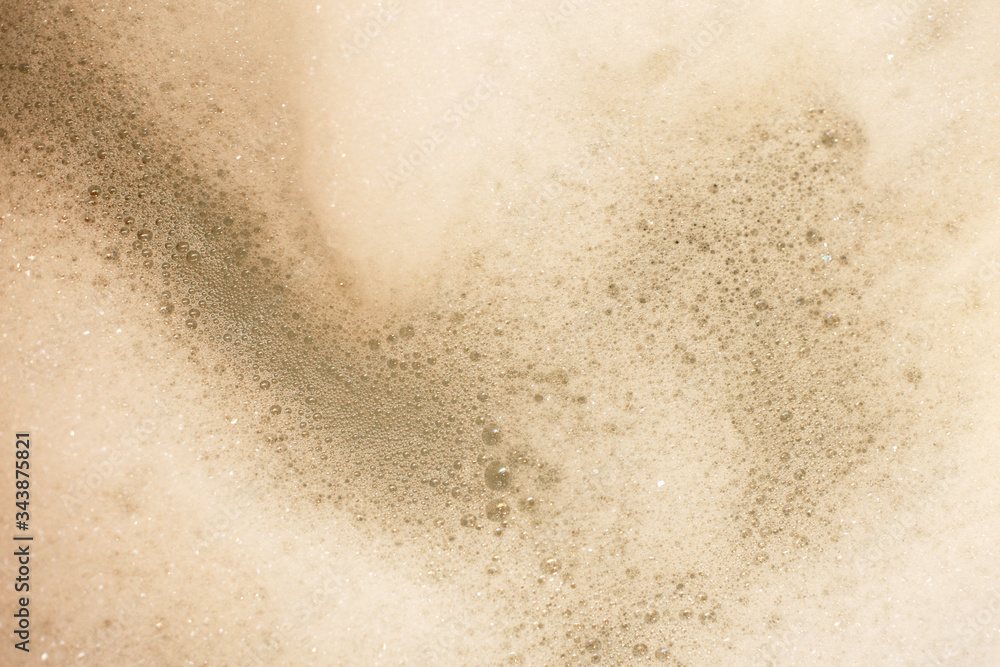 Abstract background white soapy foam texture. Shampoo foam with bubbles. foam in the bathroom background Abstract background white soapy foam texture. Shampoo foam with bubbles. foam in the bathroom background