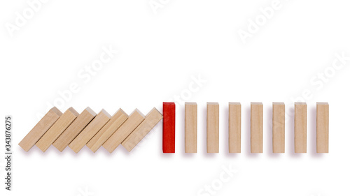 Red domino stopping the domino effect. Risk management concept.  Business strategy