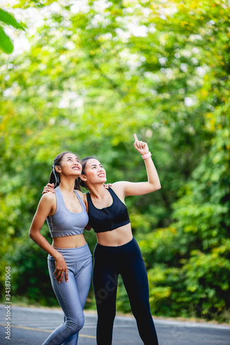 Fototapeta Naklejka Na Ścianę i Meble -  Women exercise happily for good health. Exercise concept