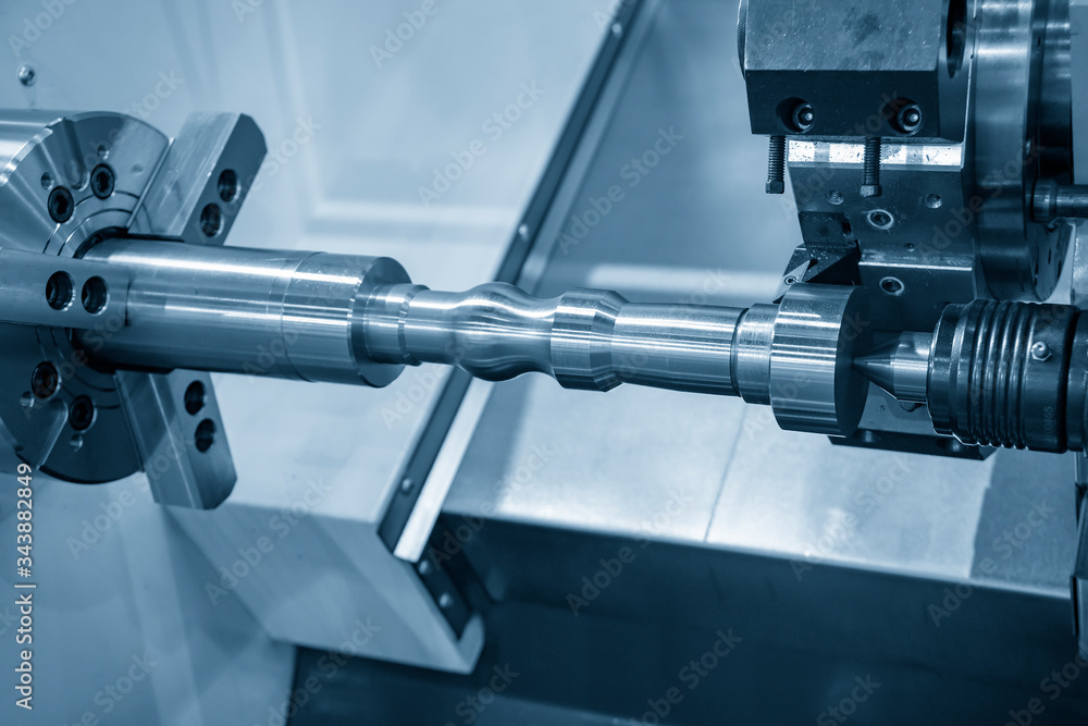 The CNC lathe machine rough cutting the metal shaft parts with cutting tools for make the automotive parts. The hi-technology metal working processing by CNC turning machine . The CNC lathe machine rough cutting the metal shaft parts with cutting tools for make the automotive parts. The hi-technology metal working processing by CNC turning machine .