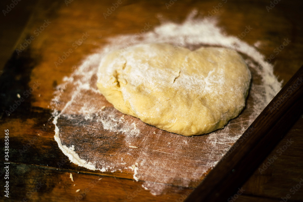 Dough on a wooden board Dough on a wooden board