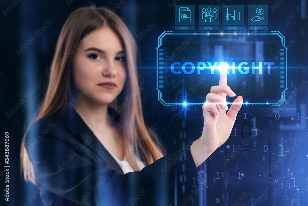 Business, Technology, Internet and network concept. Young businessman working on a virtual screen of the future and sees the inscription: Copyright Business, Technology, Internet and network concept. Young businessman working on a virtual screen of the future and sees the inscription: Copyright