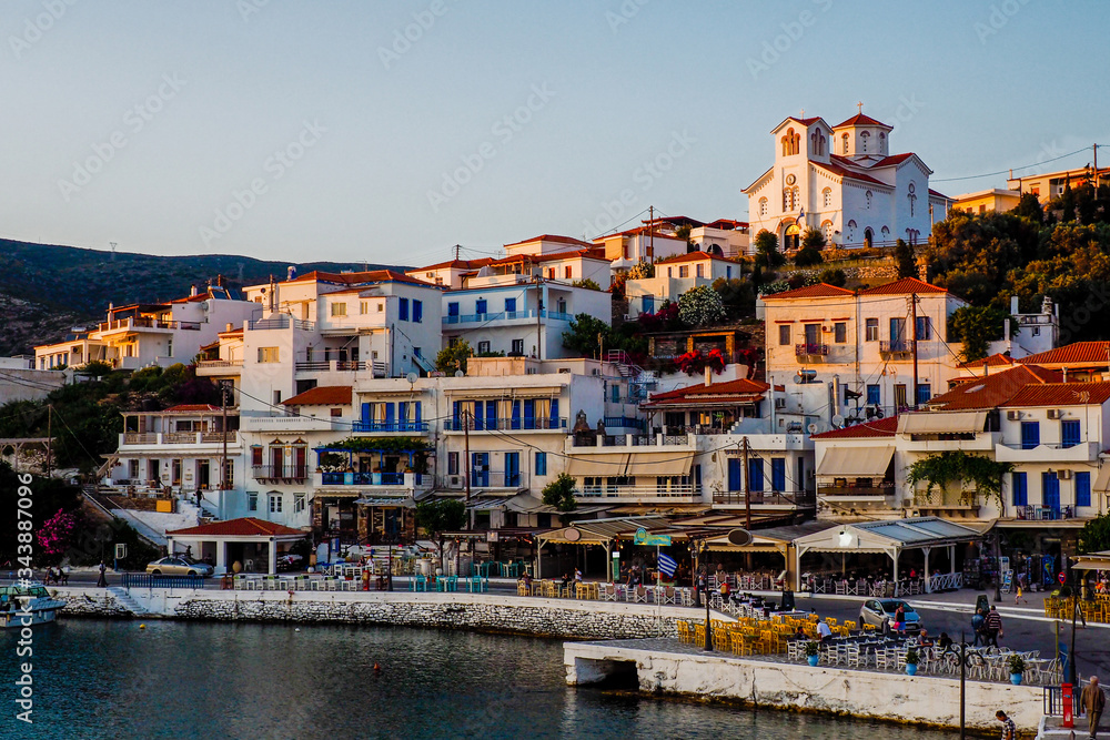 sunset above Batsi, pretty little tourist port of Andros, beautiful Cyclades islands in the heart of the Aegean Sea