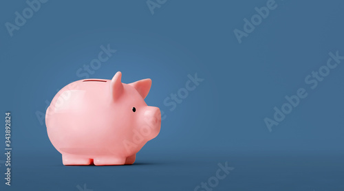 Piggy bank isolated on blue background