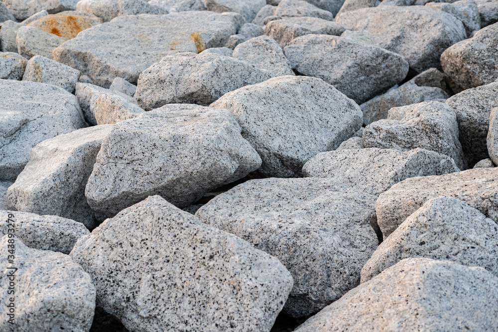 Close up. rock stone breakwater at the pier on the beach. Close up. rock stone breakwater at the pier on the beach.