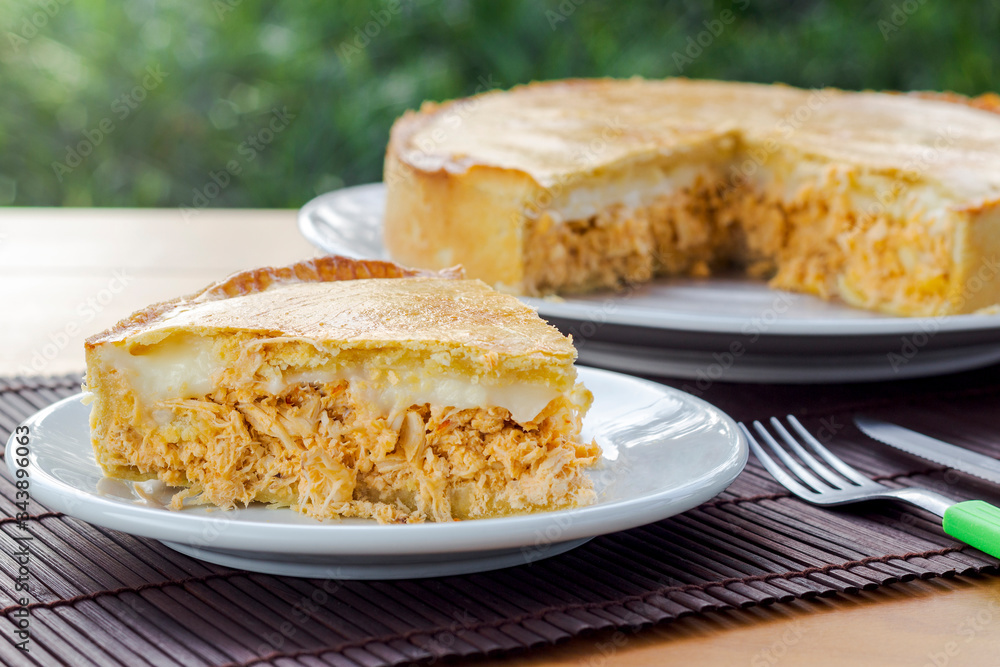 Slice of chicken pie with cheese on natural background. Slice of chicken pie with cheese on natural background.