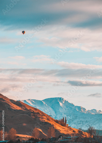 Hot air balloon flying over Frankton New Zealand on a winter morning 