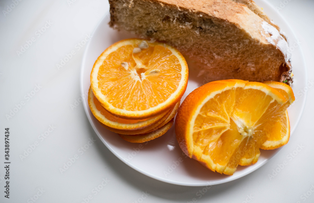 Sliced orange on a white plate Sliced orange on a white plate