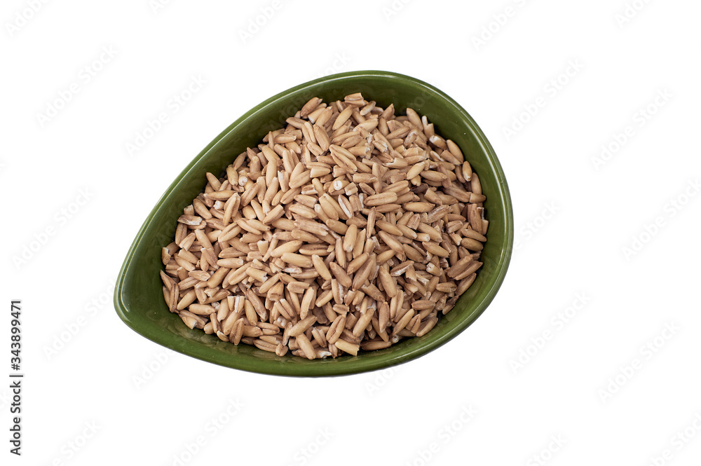 Wheat grains in bowl on white background, top view Wheat grains in bowl on white background, top view