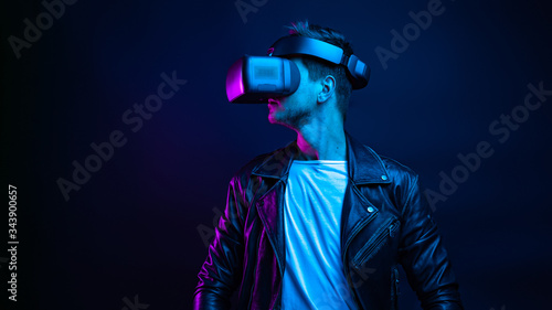 Handsome young man using a virtual reality headset
