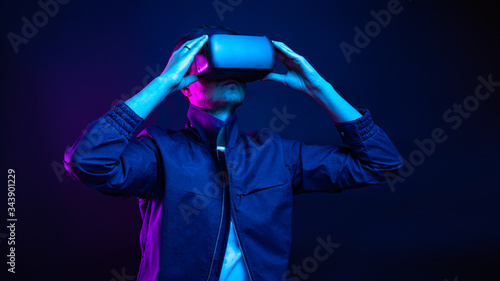 Handsome young man using a virtual reality headset