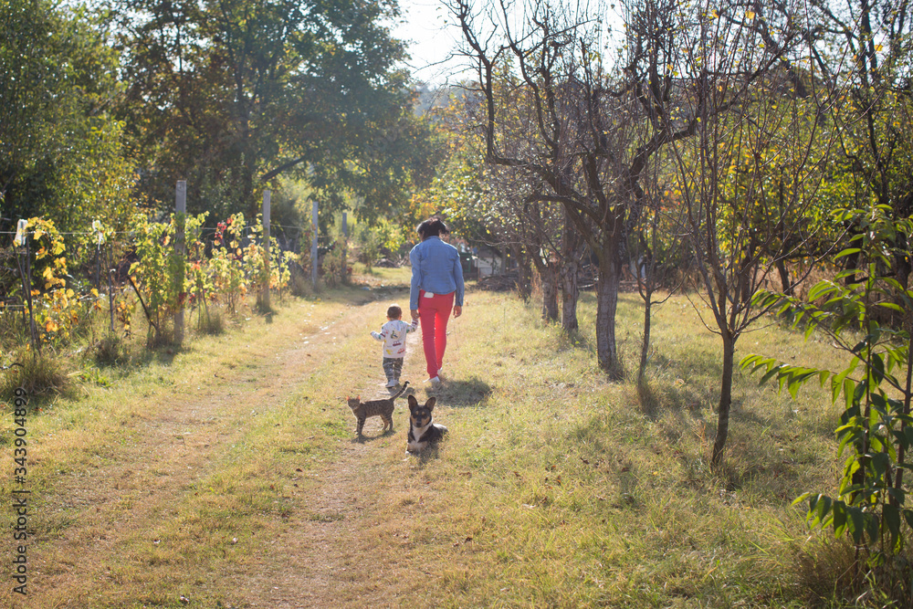 Granny and her grandson in a walk on the countryside Granny and her grandson in a walk on the countryside