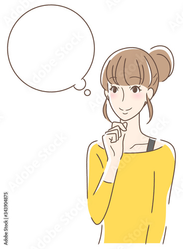 笑顔で想像する女性
