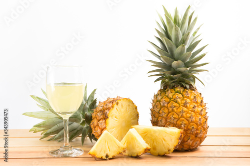 pineapple and slice with juice isolated on white