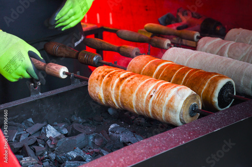 Kurtos kalacs or chimney cakes, preparing cooking photo