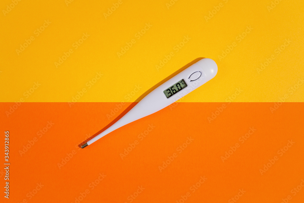 Digital thermometer on top of colorful background. View from above. Digital thermometer on top of colorful background. View from above.