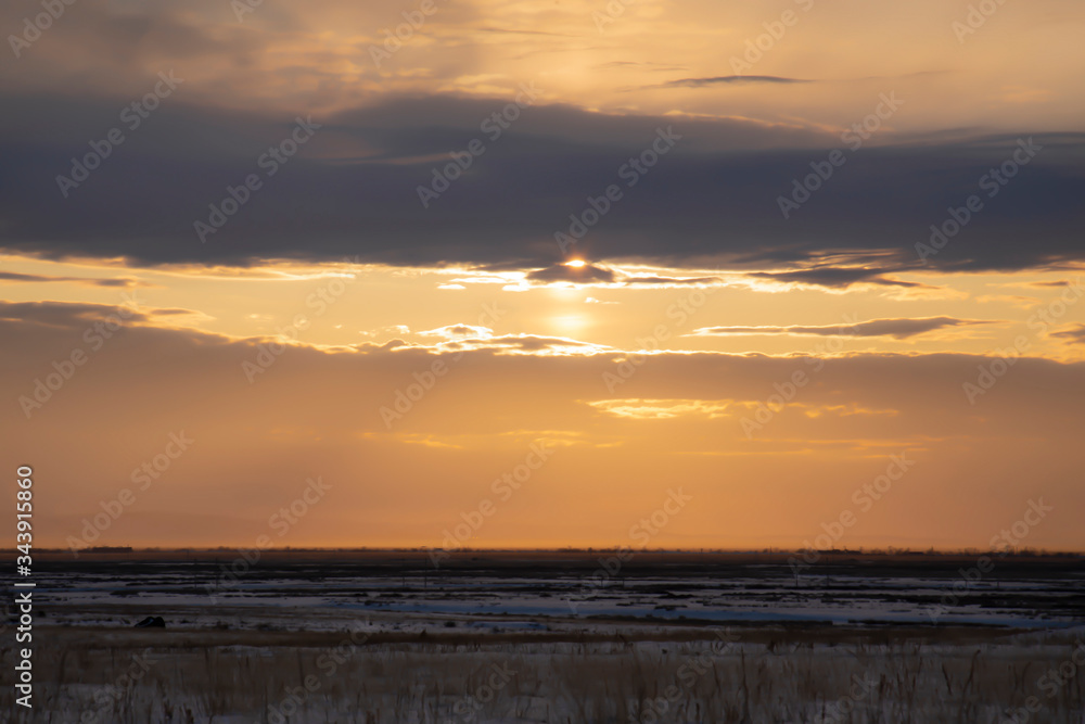 Dramatic sunset , dark clouds contrast to golden sky. Dramatic sunset , dark clouds contrast to golden sky.