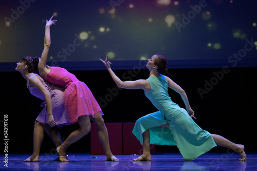 Dancer actresses young woman performs on theatrical scene in the musical show dance