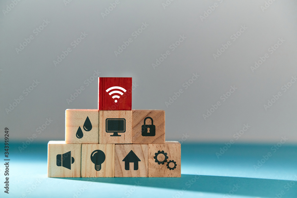 Online services. E-payment of utility services. Pyramid of wooden cubes with public utilities signs, red block on top Online services. E-payment of utility services. Pyramid of wooden cubes with public utilities signs, red block on top
