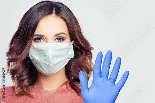 Woman in a face mask. Girl wearing medical mask portrait