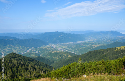 View of the village of Kolochava from the top of Mount Strymba. Beautiful Carpathian Mountains scenery, a village in the valley.