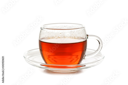 Studio shot of a glass cup of tea isolated on a white background in close-up