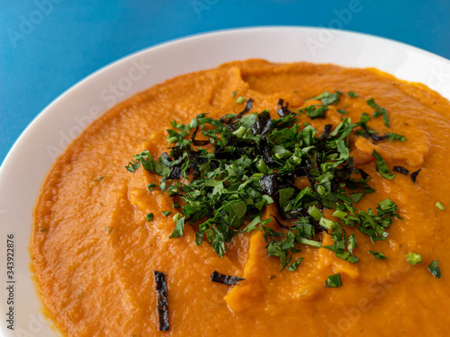 pumpkin cream soup in a white plate