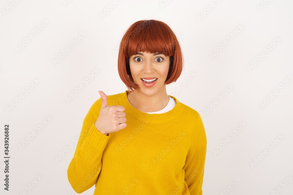Good job! Portrait of a happy smiling blue eyed young successful woman giving thumb up gesture standing outdoors. Positive human emotion facial expression body language. Funny girl Good job! Portrait of a happy smiling blue eyed young successful woman giving thumb up gesture standing outdoors. Positive human emotion facial expression body language. Funny girl