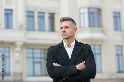 Man classic style urban background. Classic is always appropriate. Business concept. Business life. Successful and motivated. Business man wear fashionable coat. Businessman well groomed hairstyle