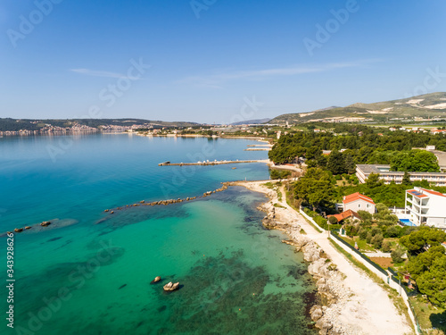 Aerial view of the bay shore on sunny day in Kastel Stafilic, Croatia. photo