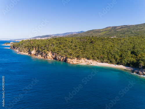 Aerial view of FKK beach surrounded by trees in Crikvenica, Croatia. photo