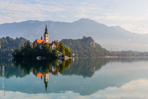 Beautiful reflection of the Bled island and castle in the lake Bled