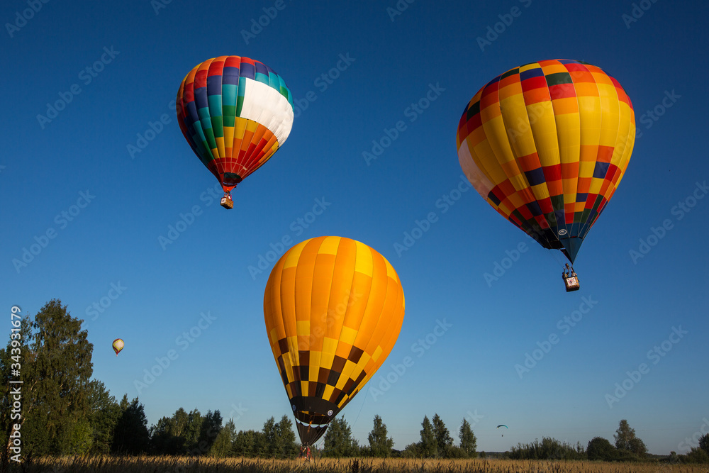 Naklejka premium 3 balloons in the blue sky