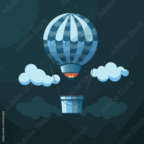 Blue balloon or aerostat in the night sky among clouds, mountains and stars.