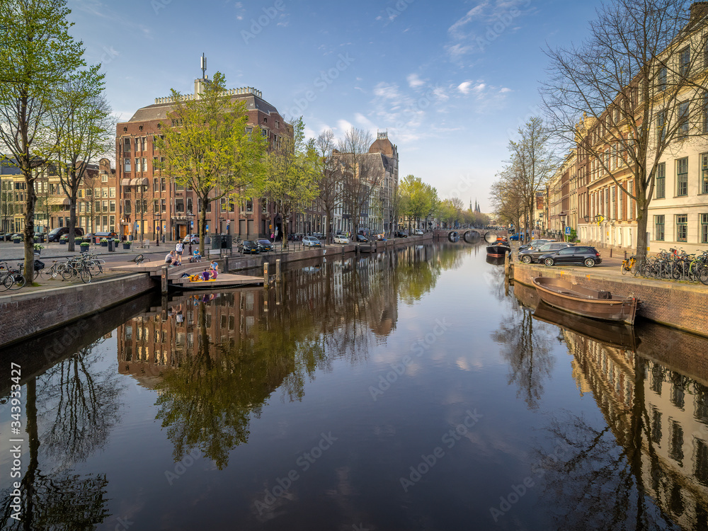 View over the Keizersgracht canal and homomonument on a spring afternoon during Corona lockdown