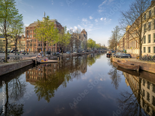View over the Keizersgracht canal and homomonument on a spring afternoon during Corona lockdown © Nik