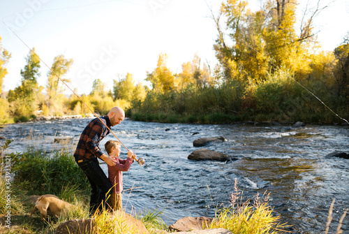 Father and son fishing together