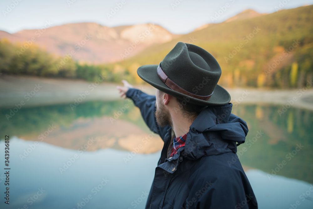 Italy, Man pointing towards mountains Italy, Man pointing towards mountains