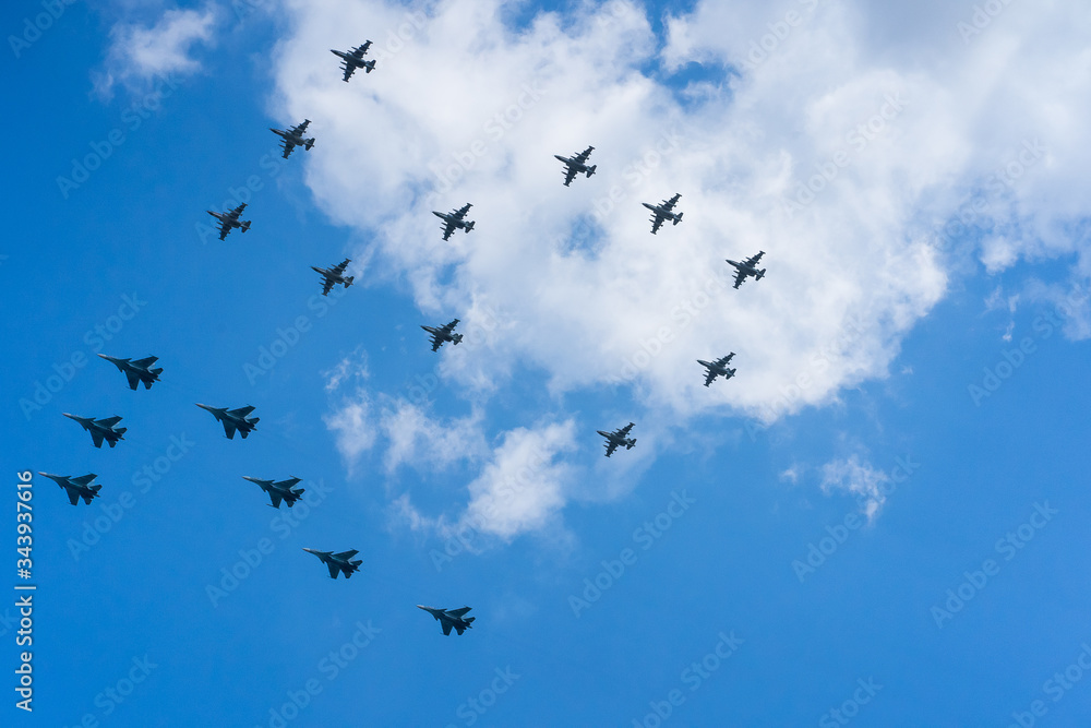 A group of professional pilots of military aircraft in sky. 