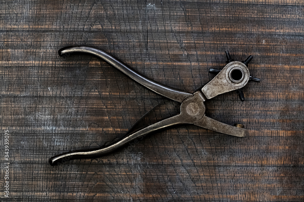 High angle close up of revolving leather hole punch. High angle close up of revolving leather hole punch.