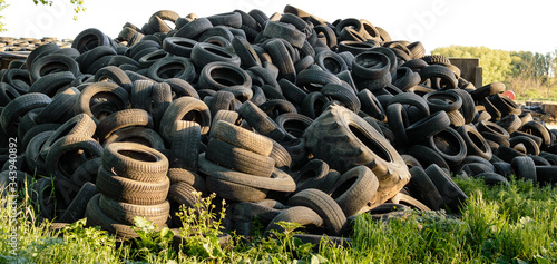 Large pile of used old, black tires