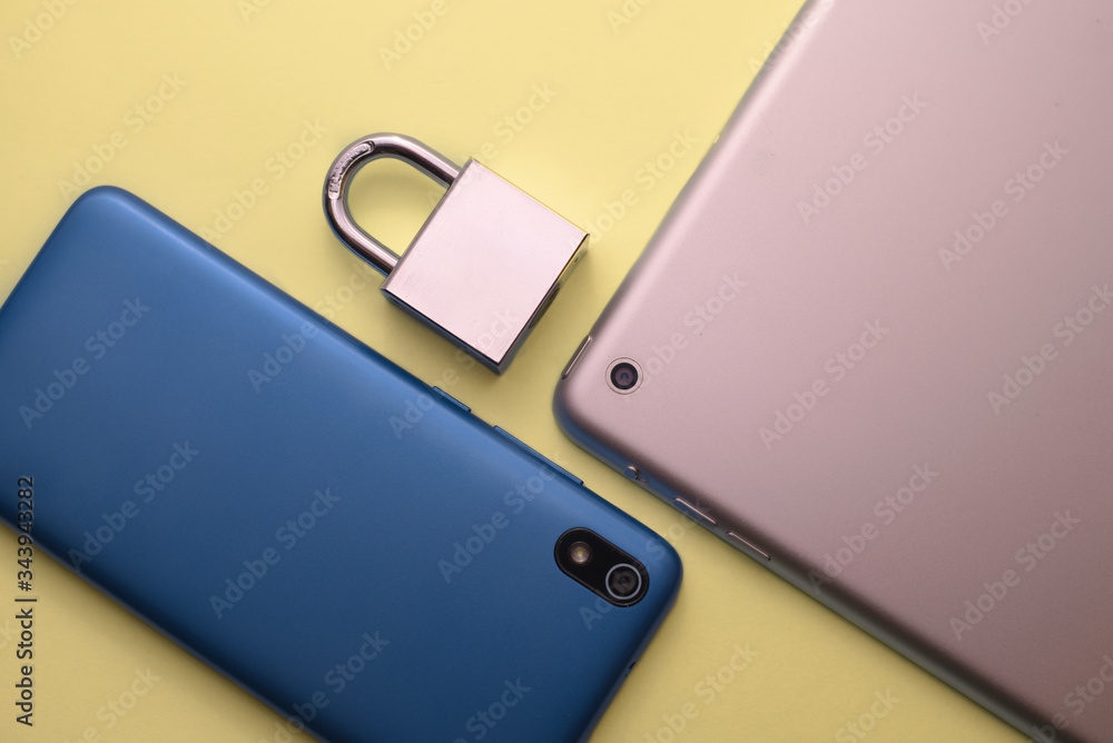 Technology and digital device and security hacking concept with a lock on the screen for digital protection. Technology and digital device and security hacking concept with a lock on the screen for digital protection.