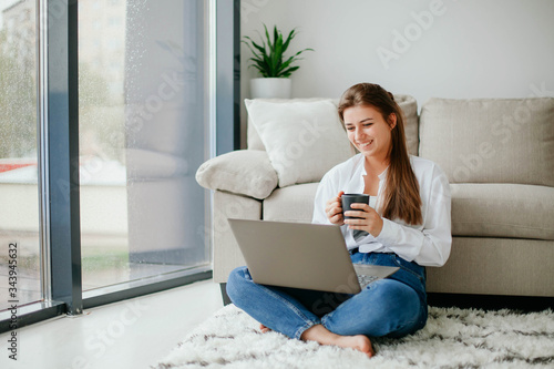 young woman working on laptop at home. work at home.  laptop. stay at home. 