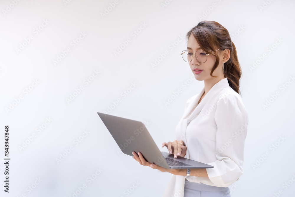 Portrait of business looking at laptop and workking in office. Young business colleagues discussing work in the office. Portrait of business looking at laptop and workking in office. Young business colleagues discussing work in the office.