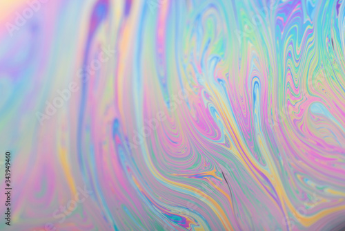 Abstract iridescent background interference light rainbow colors. Soap bubble texture