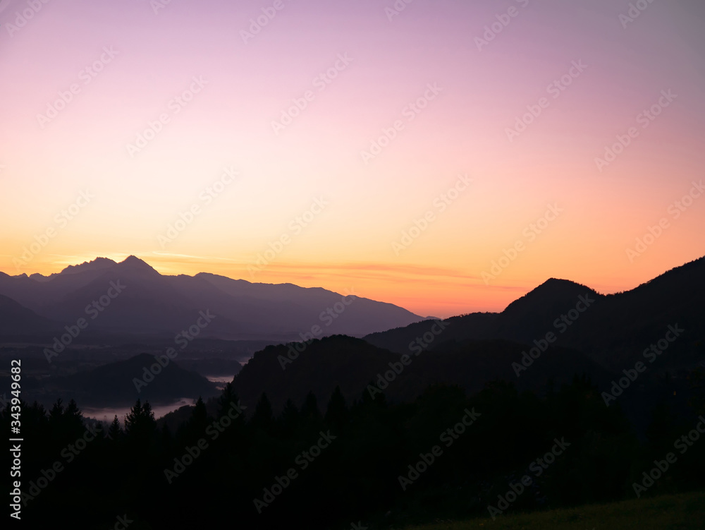 View on the beautiful sunrise over the majestic hills with the Lake Bled in Slovenia View on the beautiful sunrise over the majestic hills with the Lake Bled in Slovenia