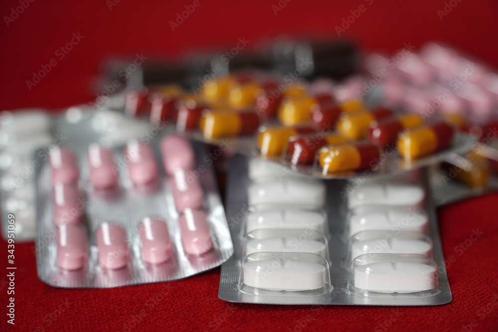 Assortment of tablets, pills and capsules: vitamins, analgesics and antibiotics. Prescription drugs, medicines and dietary supplements. Assortment of tablets, pills and capsules: vitamins, analgesics and antibiotics. Prescription drugs, medicines and dietary supplements.
