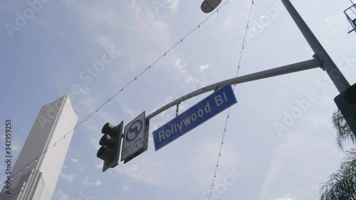 Hollywood boulevard street sign and traffic lights in 4k slow motion 60fps
