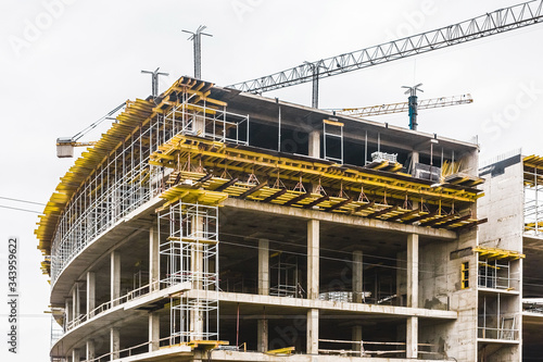 Unfinished new modern urban building at a construction site